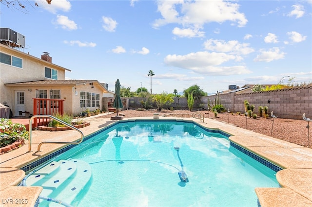 6612 Elton Ave, Las Vegas, NV 89107 - view of pool featuring a fenced backyard, a patio, and central air condition unit