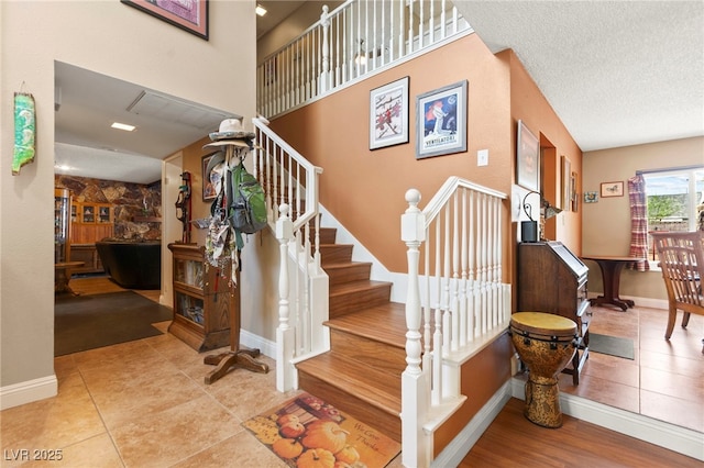 6612 Elton Ave, Las Vegas, NV 89107 - staircase with tile patterned floors and baseboards