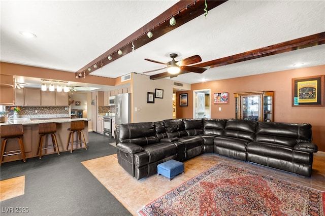 6612 Elton Ave, Las Vegas, NV 89107 - living area featuring ceiling fan and beamed ceiling