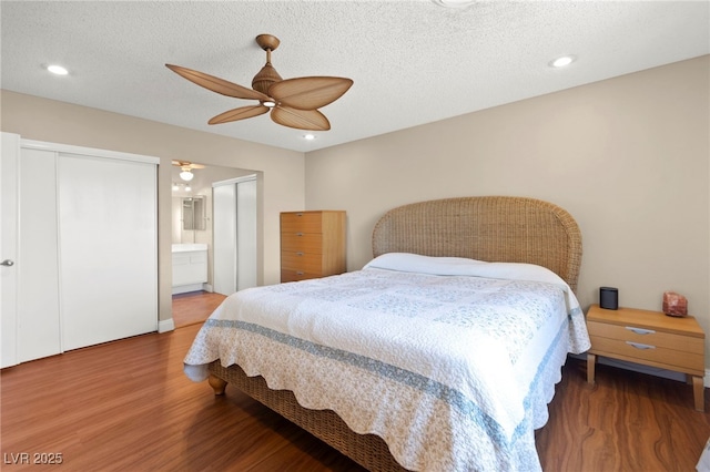 6612 Elton Ave, Las Vegas, NV 89107 - bedroom with wood finished floors, recessed lighting, ceiling fan, a textured ceiling, and ensuite bath