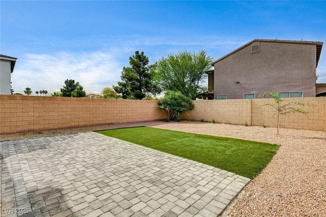 3760 Paseo De Paz Ave, Las Vegas, NV 89115 - fenced backyard with a patio area