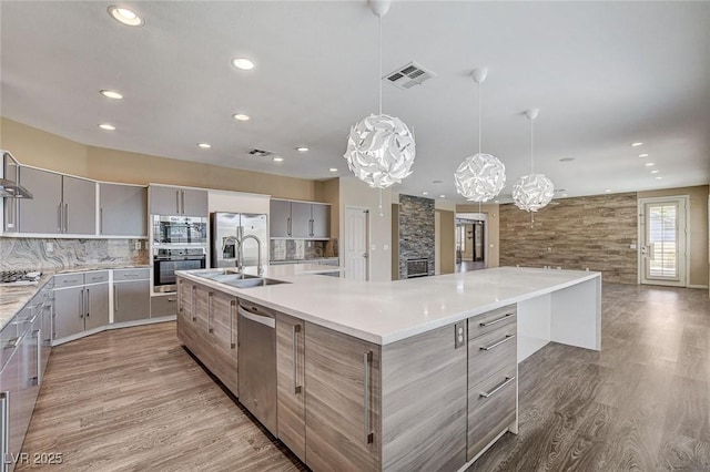 8113 Gothic Ave, Las Vegas, NV 89117 - kitchen featuring a sink, gray cabinetry, modern cabinets, and recessed lighting