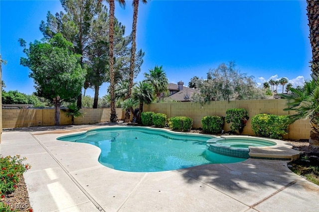 8113 Gothic Ave, Las Vegas, NV 89117 - view of pool with a fenced backyard, a pool with connected hot tub, and a patio