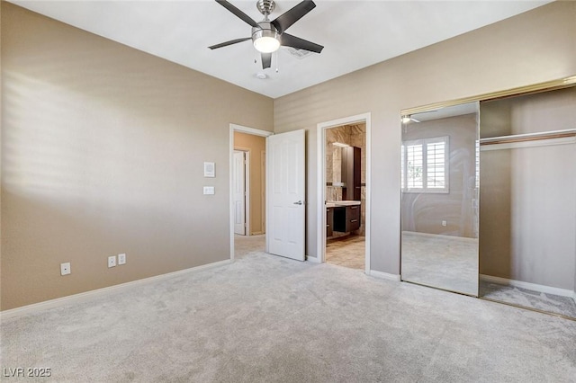 8113 Gothic Ave, Las Vegas, NV 89117 - unfurnished bedroom featuring light carpet, a closet, baseboards, connected bathroom, and a ceiling fan