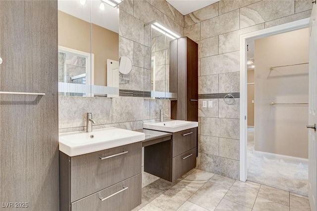 8113 Gothic Ave, Las Vegas, NV 89117 - bathroom featuring tile walls, two vanities, and tile patterned flooring