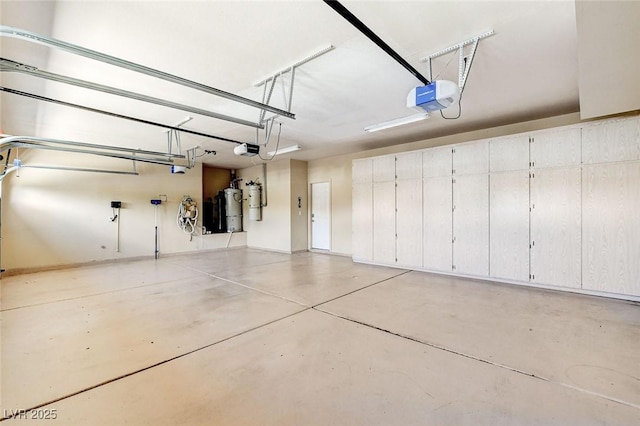 8113 Gothic Ave, Las Vegas, NV 89117 - garage with a garage door opener and a central vacuum unit