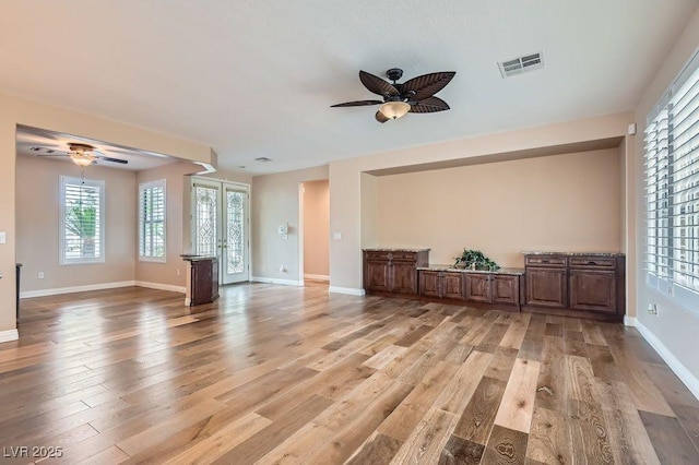 4311 Fiore Bella Blvd, Las Vegas, NV 89135 - living area featuring a ceiling fan, light wood finished floors, and plenty of natural light