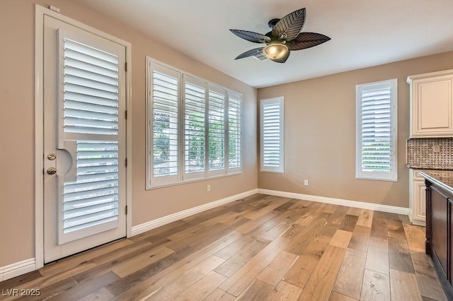 4311 Fiore Bella Blvd, Las Vegas, NV 89135 - unfurnished dining area featuring light wood-style flooring and a ceiling fan