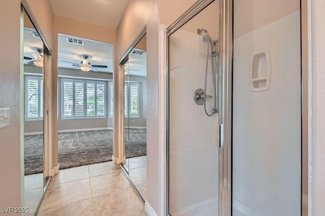 4311 Fiore Bella Blvd, Las Vegas, NV 89135 - bathroom featuring ceiling fan, a shower stall, and tile patterned flooring