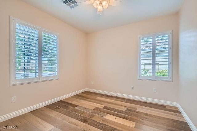 4311 Fiore Bella Blvd, Las Vegas, NV 89135 - unfurnished room with plenty of natural light, wood finished floors, and ceiling fan