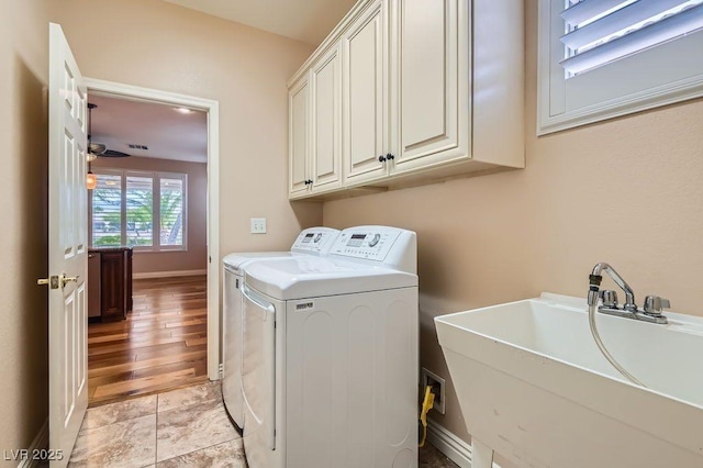 4311 Fiore Bella Blvd, Las Vegas, NV 89135 - laundry room featuring independent washer and dryer and cabinet space
