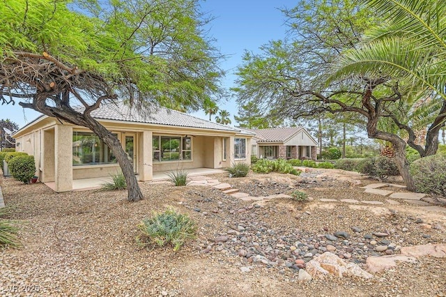 4311 Fiore Bella Blvd, Las Vegas, NV 89135 - ranch-style house featuring stucco siding, a tile roof, and a patio
