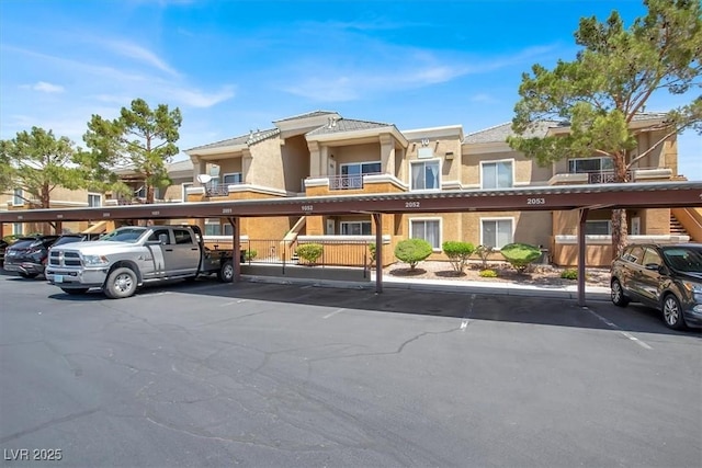 8070 W Russell Rd Unit 2052, Las Vegas, NV 89113 - view of front facade with covered parking and stucco siding