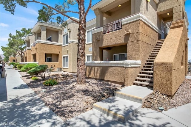8070 W Russell Rd Unit 2052, Las Vegas, NV 89113 - view of property with central AC and stairway