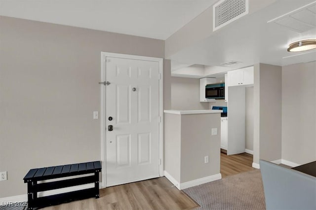8070 W Russell Rd Unit 2052, Las Vegas, NV 89113 - foyer featuring light wood-type flooring and baseboards