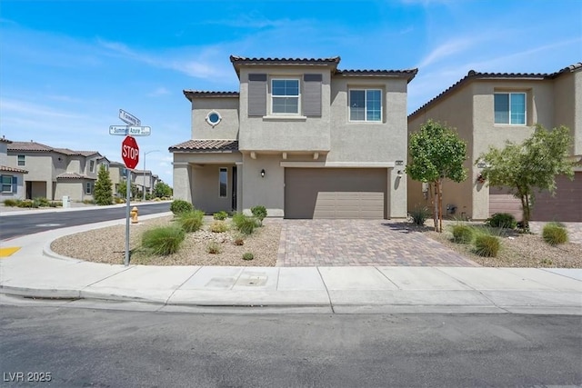 4630 Summer Azure St, North Las Vegas, NV 89031 - mediterranean / spanish-style home featuring stucco siding, driveway, a garage, and a tiled roof