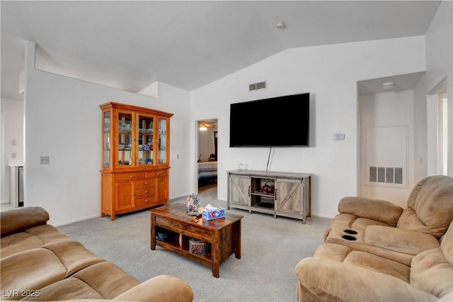 8048 Astrology Ct Unit 201, Las Vegas, NV 89128 - living room featuring vaulted ceiling, light carpet, and baseboards