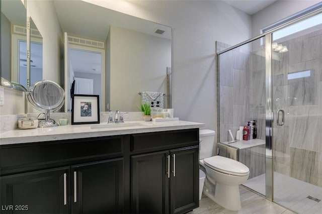 7194 Sage Wren Ct, Las Vegas, NV 89148 - bathroom with vanity, toilet, and a shower stall