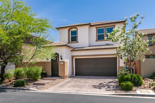 7194 Sage Wren Ct, Las Vegas, NV 89148 - view of front of home featuring stucco siding, an attached garage, a tile roof, and driveway