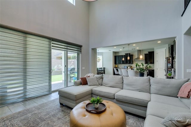 7194 Sage Wren Ct, Las Vegas, NV 89148 - living area with a towering ceiling and healthy amount of natural light