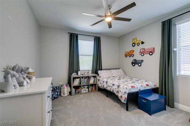 7194 Sage Wren Ct, Las Vegas, NV 89148 - bedroom with light colored carpet, a ceiling fan, and baseboards