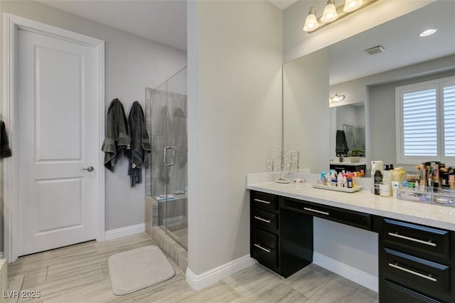 7194 Sage Wren Ct, Las Vegas, NV 89148 - full bathroom with vanity, a shower stall, baseboards, and wood finished floors