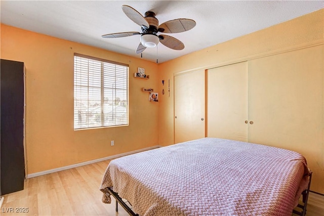 6058 Grape Blossom Ave, Las Vegas, NV 89142 - bedroom with light wood finished floors, a closet, and a ceiling fan