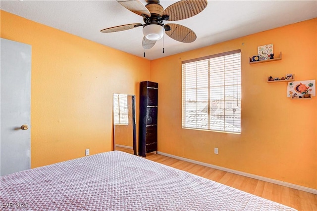 6058 Grape Blossom Ave, Las Vegas, NV 89142 - bedroom with wood finished floors and ceiling fan