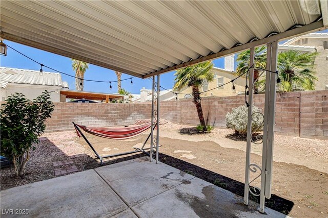 6058 Grape Blossom Ave, Las Vegas, NV 89142 - fenced backyard with a patio