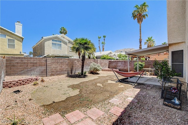 6058 Grape Blossom Ave, Las Vegas, NV 89142 - fenced backyard featuring a patio area