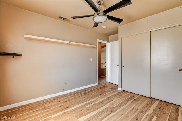 6058 Grape Blossom Ave, Las Vegas, NV 89142 - unfurnished bedroom with light wood finished floors, a closet, and a ceiling fan