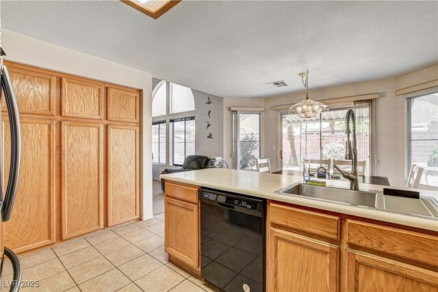 6058 Grape Blossom Ave, Las Vegas, NV 89142 - kitchen with black dishwasher, light tile patterned flooring, a chandelier, and healthy amount of natural light