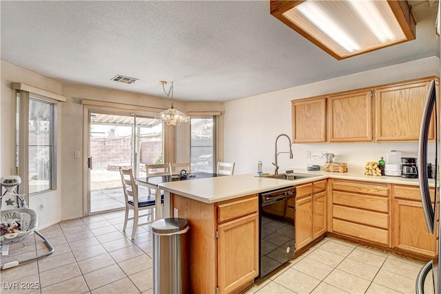 6058 Grape Blossom Ave, Las Vegas, NV 89142 - kitchen with dishwasher, a peninsula, light countertops, light tile patterned flooring, and a textured ceiling