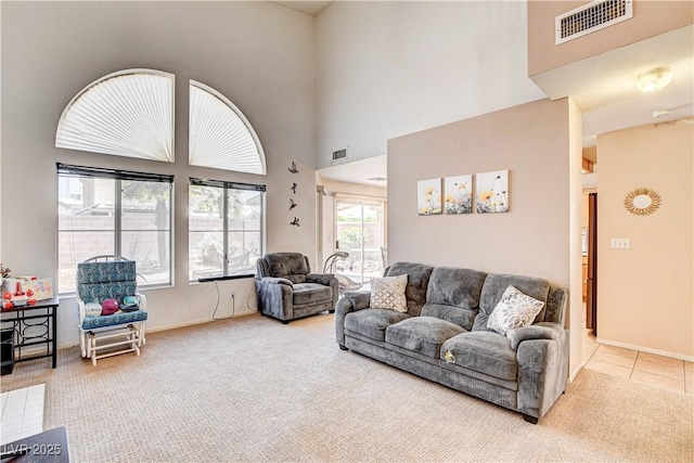6058 Grape Blossom Ave, Las Vegas, NV 89142 - carpeted living area featuring a high ceiling