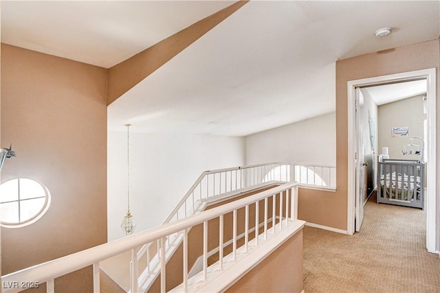 6058 Grape Blossom Ave, Las Vegas, NV 89142 - hall featuring an upstairs landing and carpet floors