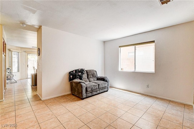 6058 Grape Blossom Ave, Las Vegas, NV 89142 - living area with baseboards and light tile patterned floors