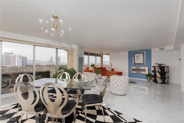 3111 Bel Air Dr Unit 12G, Las Vegas, NV 89109 - dining area with a chandelier and marble tiled floors