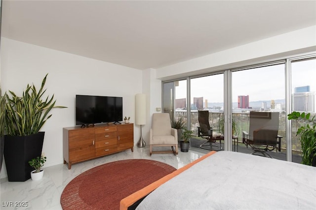 3111 Bel Air Dr Unit 12G, Las Vegas, NV 89109 - bedroom featuring access to exterior and light marble finish flooring