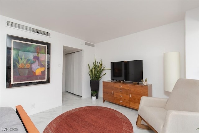 3111 Bel Air Dr Unit 12G, Las Vegas, NV 89109 - living room featuring light marble finish flooring