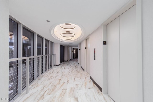 3111 Bel Air Dr Unit 12G, Las Vegas, NV 89109 - corridor featuring elevator and light marble finish floors