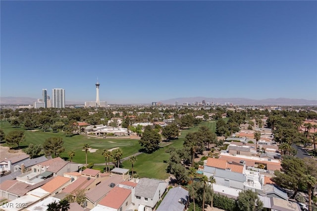 3111 Bel Air Dr Unit 12G, Las Vegas, NV 89109 - aerial perspective of suburban area featuring a golf course and a mountainous background