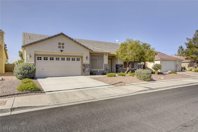1408 Reebok Ter, Henderson, NV 89014 - view of front of house featuring a tiled roof, a garage, stucco siding, and concrete driveway