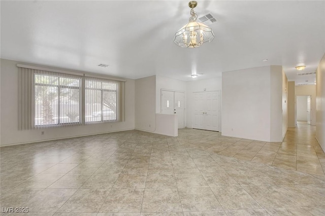 1408 Reebok Ter, Henderson, NV 89014 - unfurnished living room featuring a chandelier and light tile patterned floors