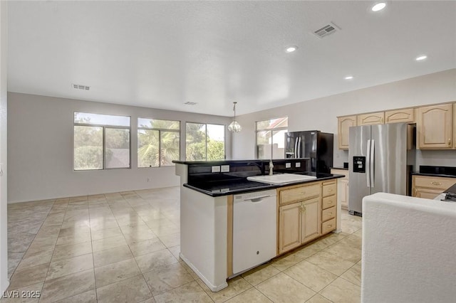 1408 Reebok Ter, Henderson, NV 89014 - kitchen with dishwasher, stainless steel fridge, light brown cabinetry, fridge with ice dispenser, and a sink