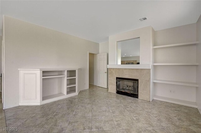1408 Reebok Ter, Henderson, NV 89014 - unfurnished living room featuring built in features, a fireplace, tile patterned floors, and baseboards