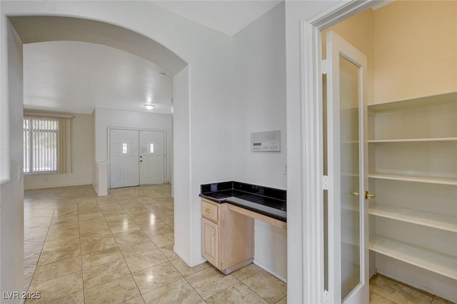1408 Reebok Ter, Henderson, NV 89014 - kitchen featuring dark countertops and arched walkways