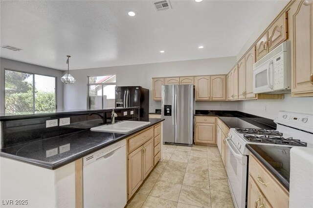 1408 Reebok Ter, Henderson, NV 89014 - kitchen with white appliances, light brown cabinets, a kitchen island with sink, dark countertops, and recessed lighting