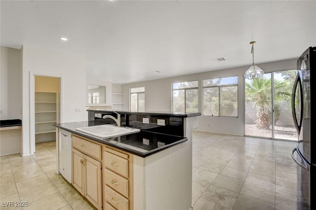 1408 Reebok Ter, Henderson, NV 89014 - kitchen with a sink, dark countertops, freestanding refrigerator, a chandelier, and dishwasher