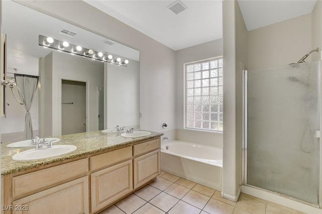 1408 Reebok Ter, Henderson, NV 89014 - bathroom with a garden tub, a shower stall, tile patterned flooring, and double vanity