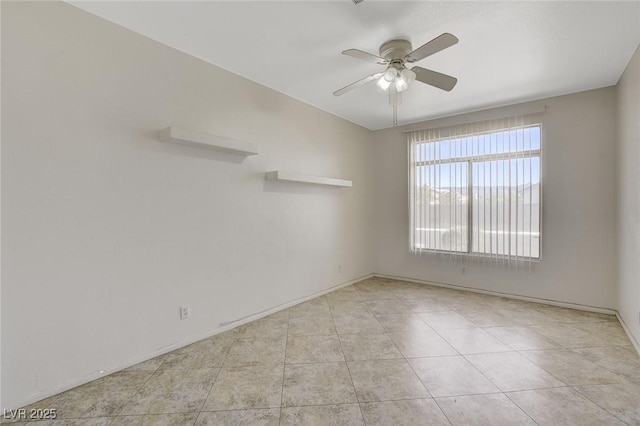 1408 Reebok Ter, Henderson, NV 89014 - empty room featuring a ceiling fan, light tile patterned floors, and baseboards